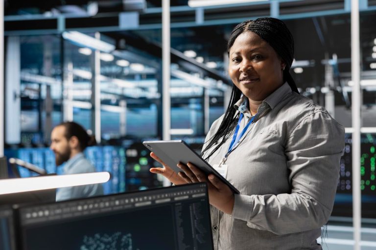 portrait-smiling-data-center-programmer-using-tablet-update-servers-tech_482257-126254